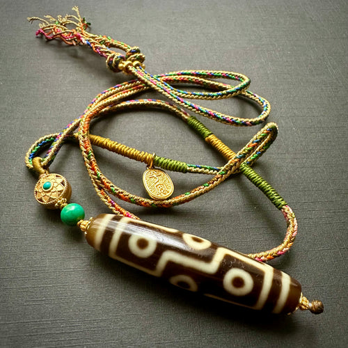 9-Eye Dzi bead on Waven  Cord Necklace