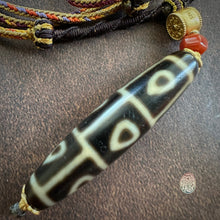 Buddha’s Heart 9 -Eye dZi bead on Waven  Cord Necklace