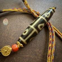 Buddha’s Heart 9 -Eye dZi bead on Waven  Cord Necklace